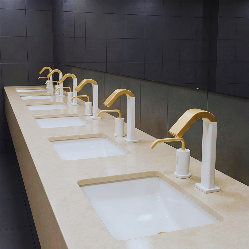 Commercial healthcare sink with laminar outlet touchless faucet and blue restroom wall accents